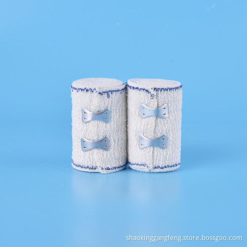 Absorbent elastic crepe bandage with blue/red line